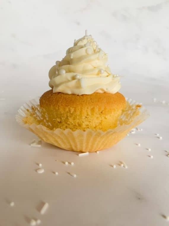 gluten free vanilla cupcake on a white background.