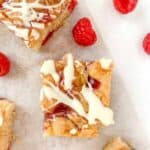 gluten free raspberry and white chocolate blondies sliced into squares