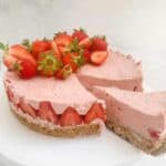 strawberry cheesecake being sliced