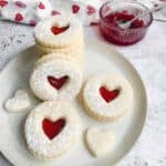 gluten free stacked on a white plate with a clear bowl filled with strawberry jam behind