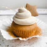 gluten free gingerbread cupcake topped with cinnamon buttercream and a gingerbread star