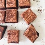 chocolate sprinkle cake sliced into squares on a white background.