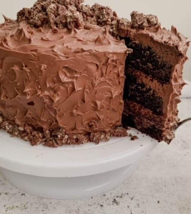 A slice of cake being removed from the chocolate cake.