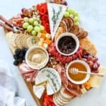 Complete gluten free charcuterie board on a white surface.