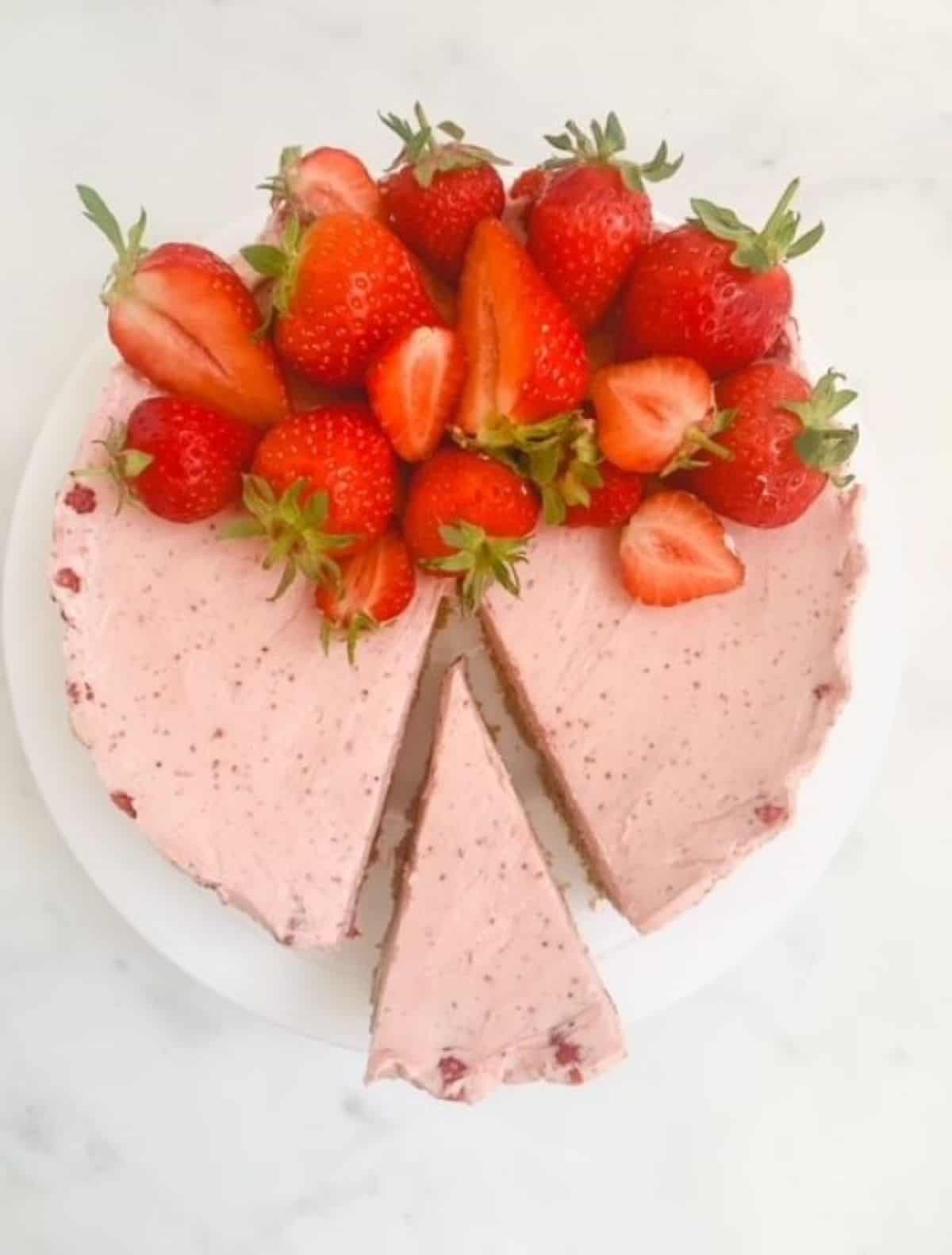 strawberry cheesecake topped with fresh strawberries.
