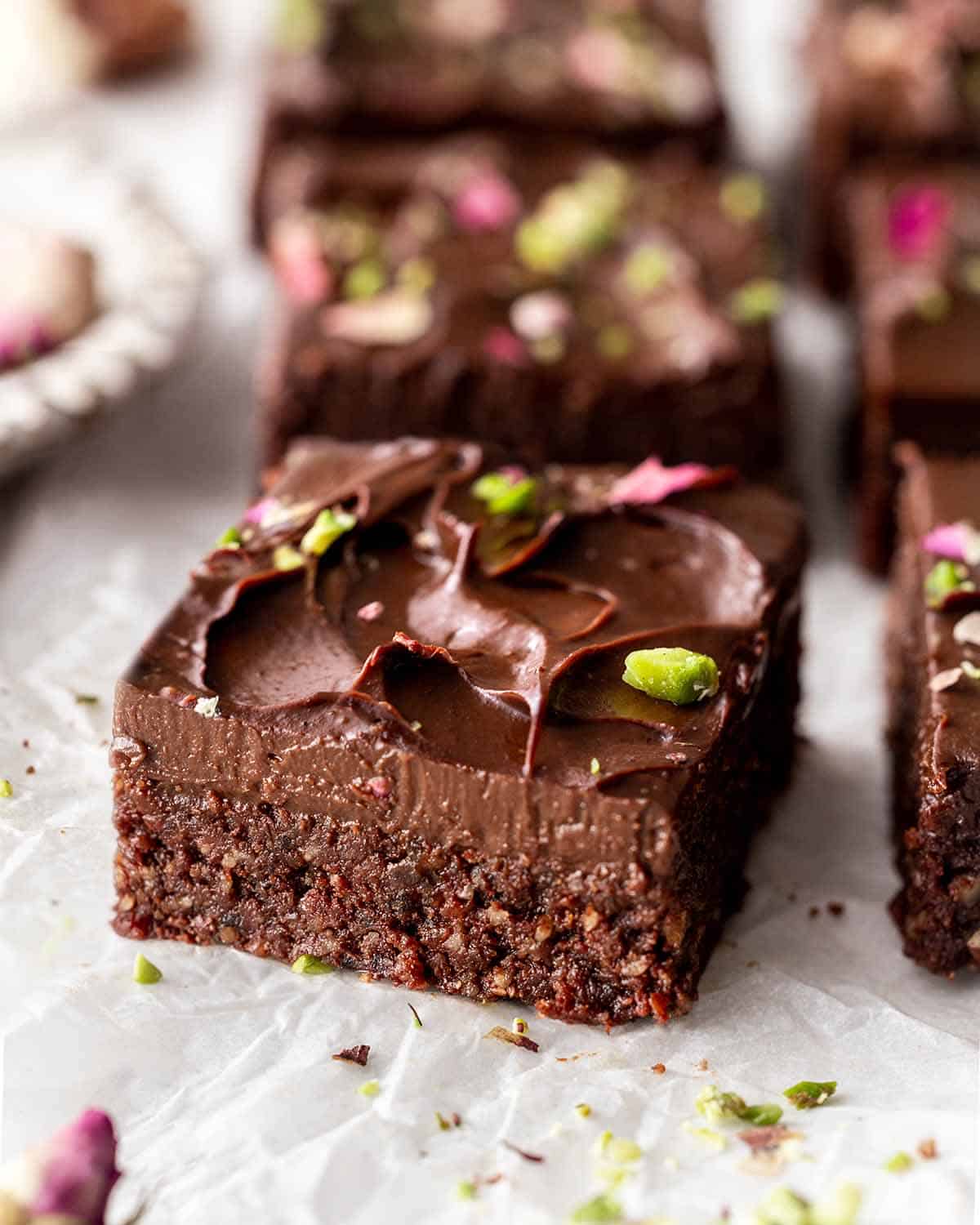 Sliced no bake brownies on a white background.