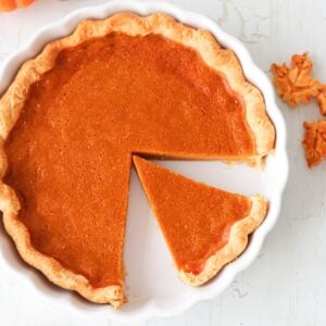 Overhead shot of gluten free pumpkin pie in a white pie dish.