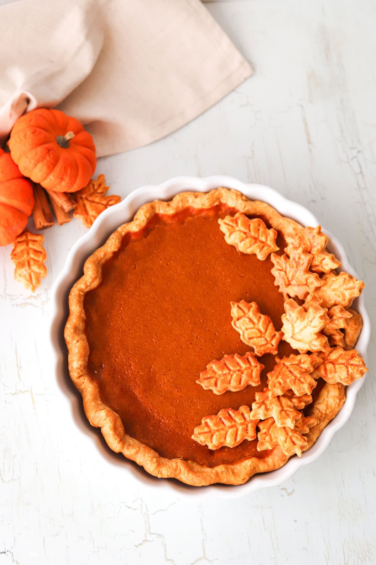 Overhead shot of gluten free pumpkin pie in a white pie dish.