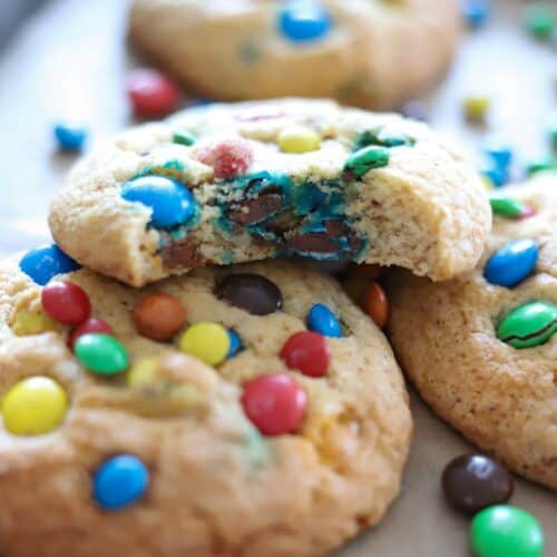 Gluten free m and m cookies with a bite taken out.