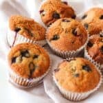 Close-up of gluten free blueberry muffins on a white background.