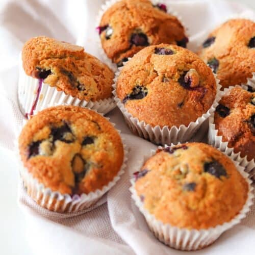 Close-up of gluten free blueberry muffins on a white background.
