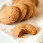 Gluten free gingersnaps cookies on a beige napkin.