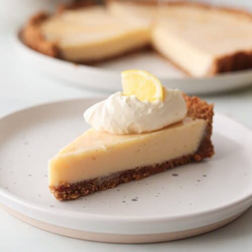 A slice of gluten free lemon pie on a white plate.