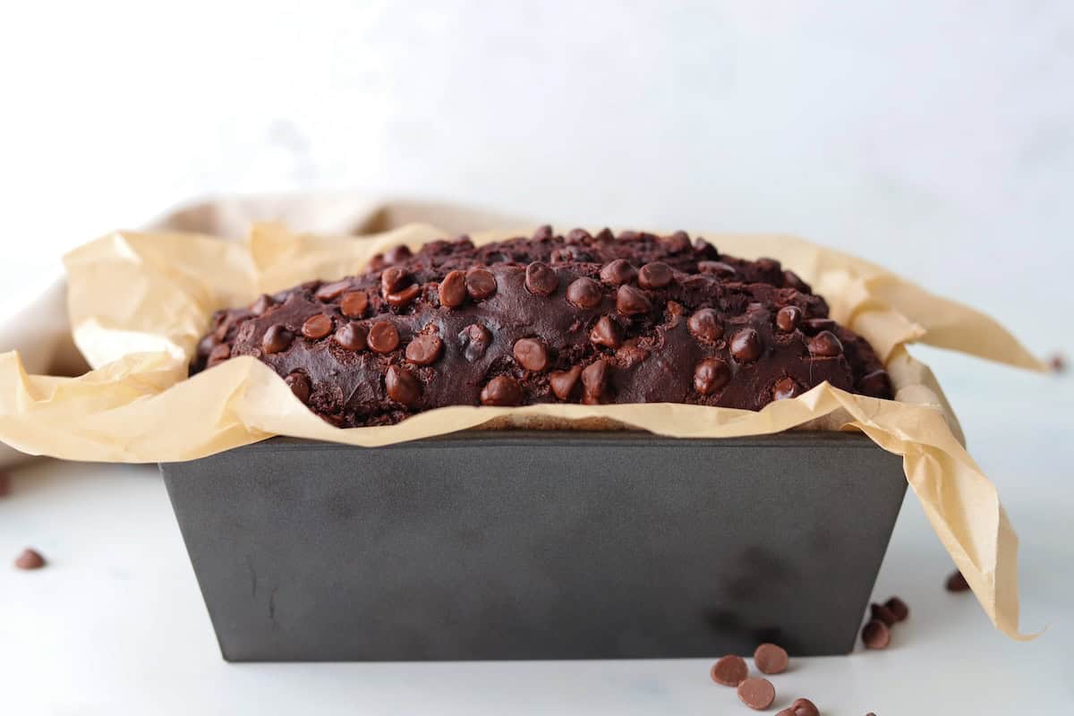 Gluten free double chocolate banana bread in a baking pan.
